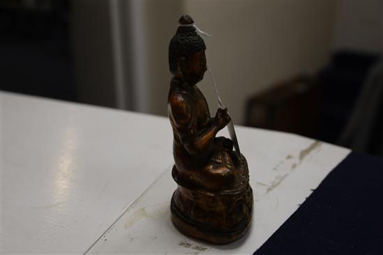 A Chinese gilt lacquered bronze figure of Buddha, 18th/19th century, H. 7.3cm, repair to neck